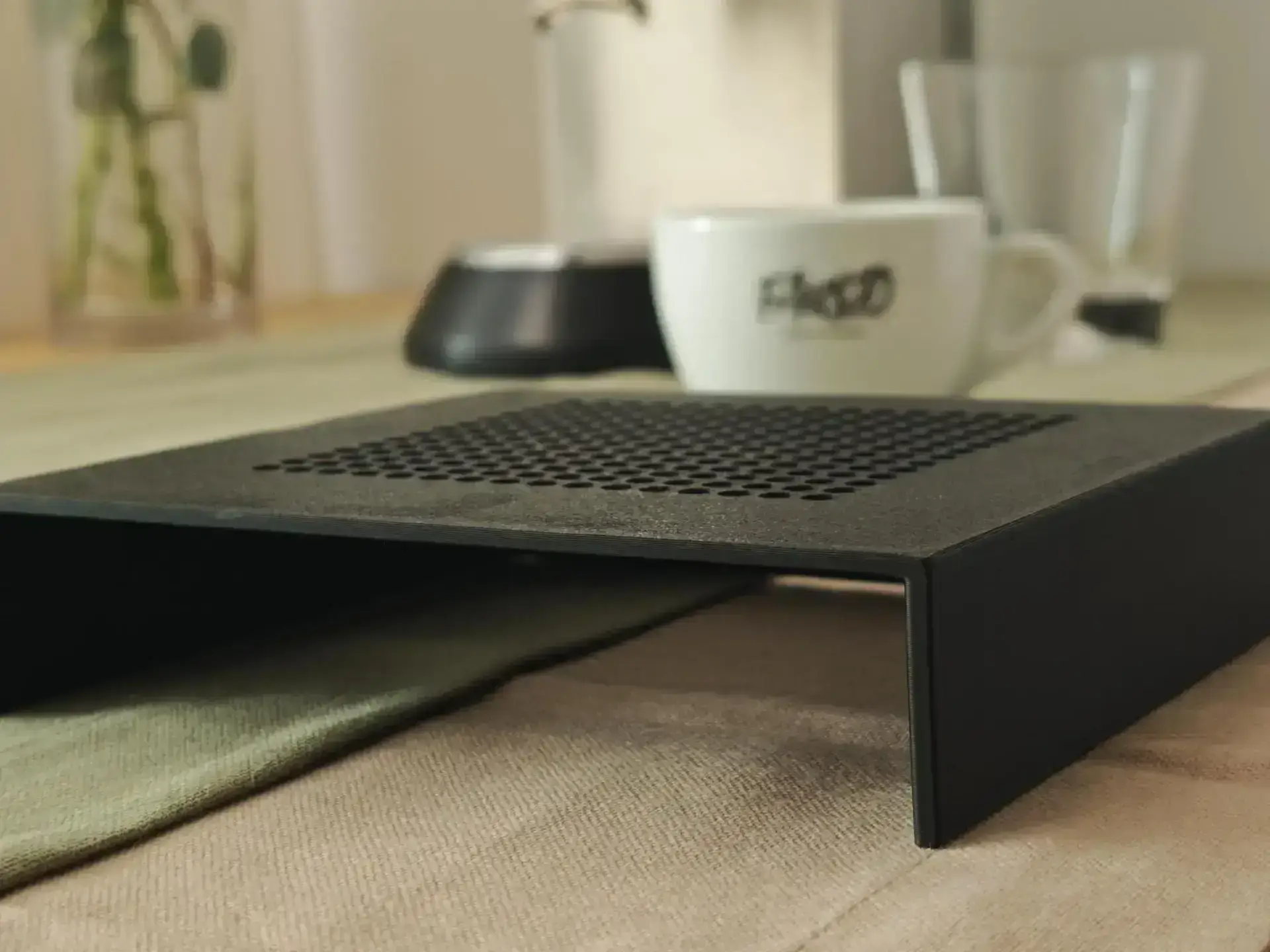The tray from the side: the flat profile next to an espresso cup