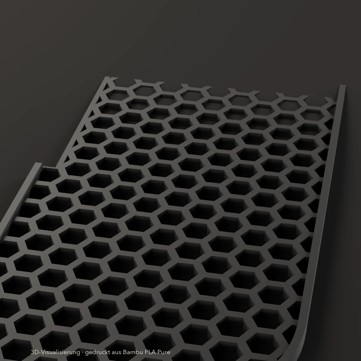 Wabenfeld der Tassenablage Honeycomb aus der Nähe, mattschwarz mit Schichtlinien